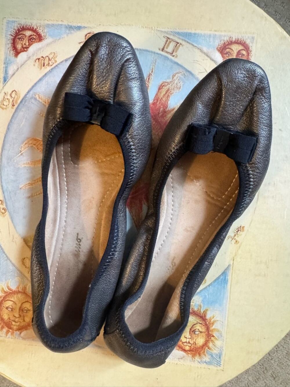 Salvatore Ferragamo Metallic Black Leather Bow Ballet  flats the color is bronze